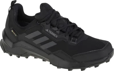 A studio shot of a single black hiking shoe.