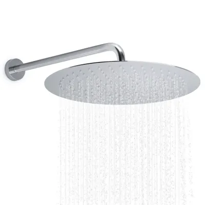 A chrome shower head with water spraying from it, mounted on a wall arm.
