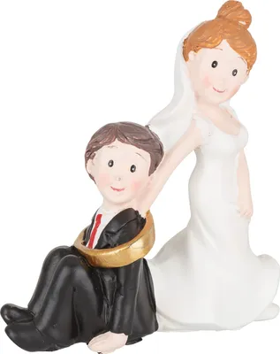 A wedding cake topper featuring a bride and groom.