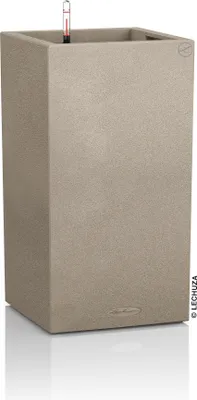 A tall, square, sand-colored planter with a water level indicator visible at the top.