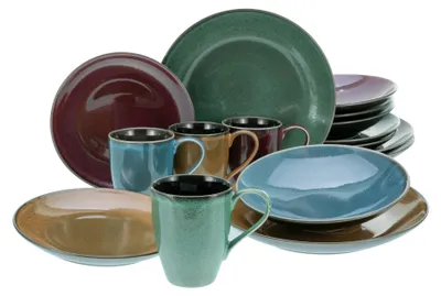 A collection of stoneware plates and mugs in various colors.