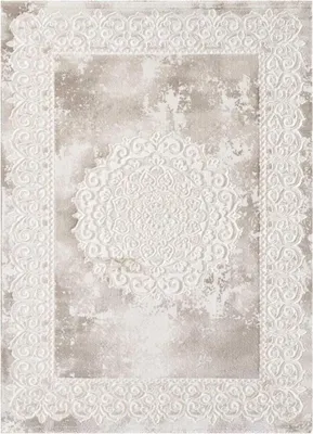 A rug with a distressed, ornate pattern.