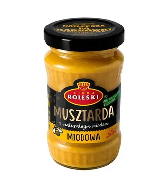 A jar of mustard on a white background.