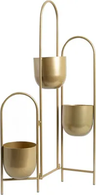 A gold-colored metal plant stand with three pots.