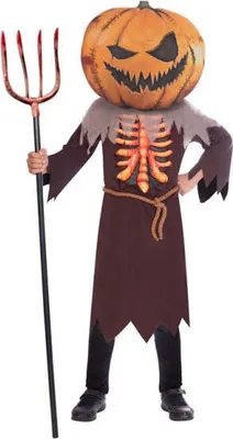 A child wearing a pumpkin head horror costume and holding a trident.