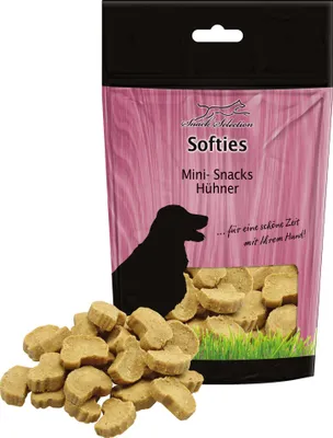 A bag of dog treats with some treats spilled in front of it.