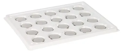 A white tray with multiple circular compartments, each containing a silver disc.