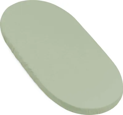 A light green fitted sheet for a crib or bassinet is shown on a white background.