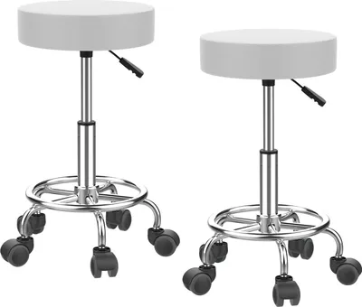 Two white adjustable stools with silver bases and wheels.