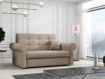 A beige sofa is shown in a well-lit room with a large window overlooking a snowy landscape.