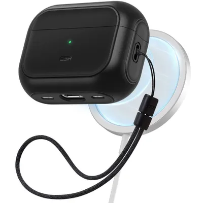 A black AirPods Pro case is shown attached to a white magnetic charger.