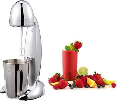A chrome milkshake mixer with a stainless steel cup is shown next to a glass of red smoothie surrounded by fresh fruits.
