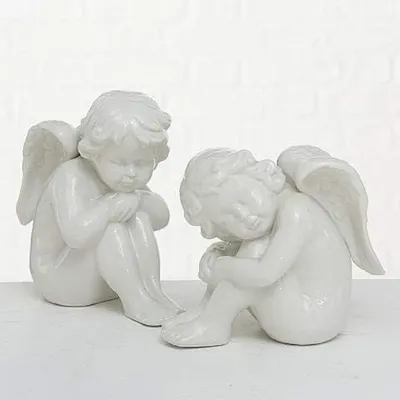 Produktbild von Dekofigur Engel sitzend Porzellan weiß H.24 cm Stückpreis