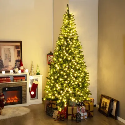 A decorated Christmas tree with presents underneath, next to a fireplace and mantelpiece with Christmas decorations.