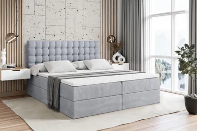 A bedroom scene with a bed as the main focus.