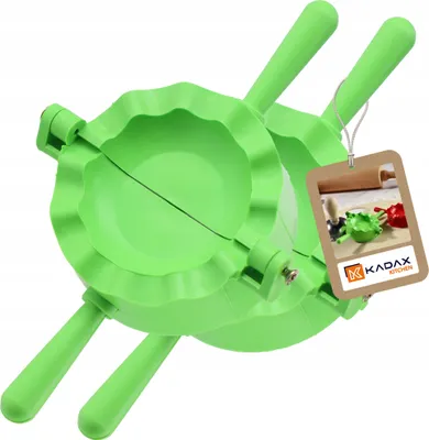 A green ravioli maker is shown on a white background, with a tag attached.