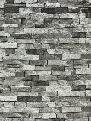 A close-up view of a stone-effect wallpaper pattern.