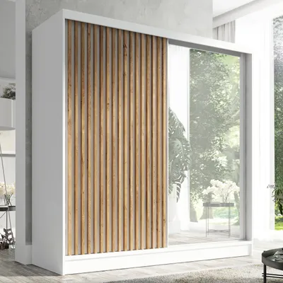 A modern white wardrobe with a slatted wood door and a mirrored door, set against a light gray and white background, with a glimpse of an outdoor scene through the mirror.