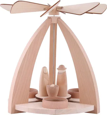 A wooden Christmas pyramid with nativity figures.