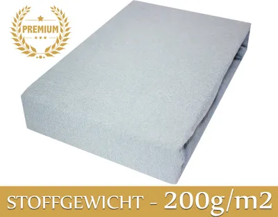 A light gray fitted sheet is shown at an angle on a white background.