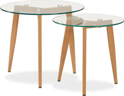 Two round glass-top nesting tables with wooden legs.