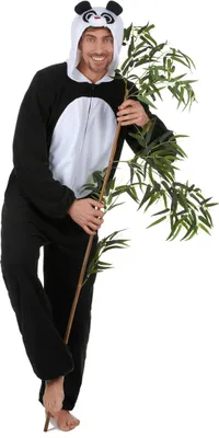 A man in a panda costume holding a bamboo stalk.