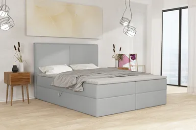 A bedroom scene with a bed as the main focus.