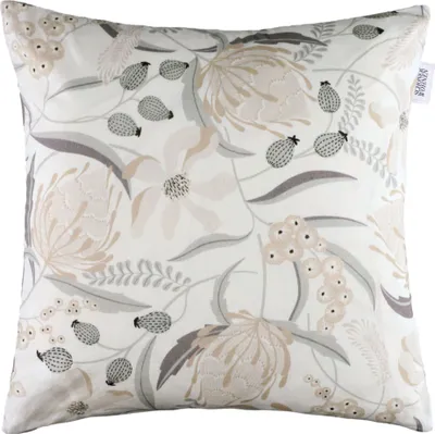 A close-up studio shot of a decorative pillow cover with a floral pattern.