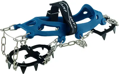 A pair of blue crampons with metal spikes and chains, shown against a white background.