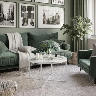 A living room scene with a green sofa, coffee table, and plants.