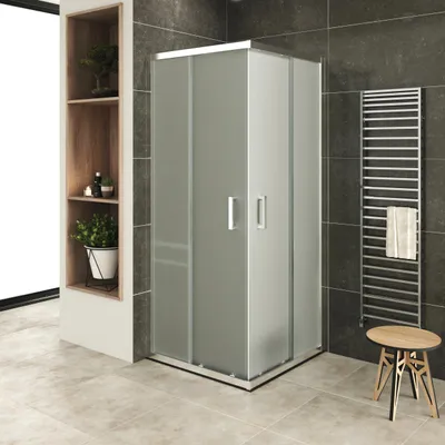 A modern bathroom with a shower cabin, towel rack, and a small stool.