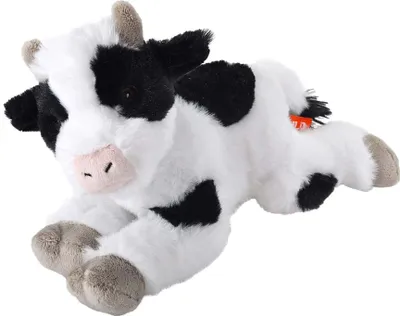 A plush toy cow lying down on a white background.