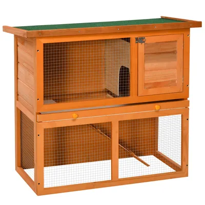 A two-tiered wooden pet cage with a green roof, displayed against a white background.