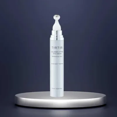 A TIRTIR Collagen Lifting Eye Cream product displayed on a silver pedestal against a dark blue background.