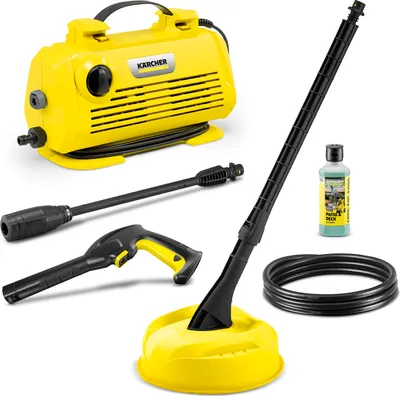 A collection of Kärcher pressure washer accessories and a bottle of cleaning solution are arranged on a white background.