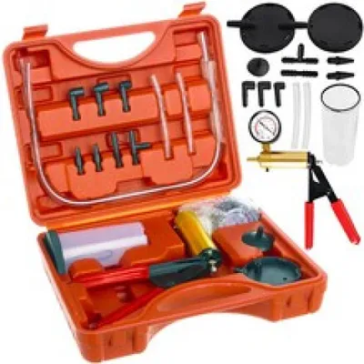A vacuum pump kit with various accessories laid out in an orange case.