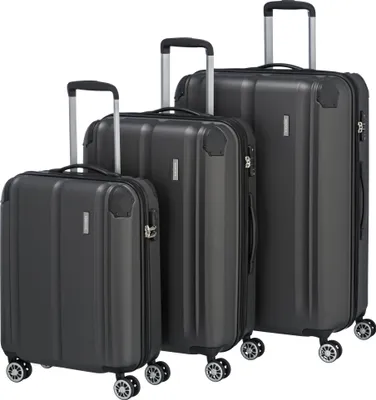Three dark gray suitcases of different sizes are arranged diagonally on a white background.