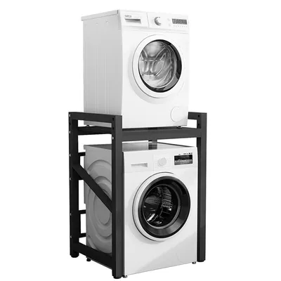 A black metal stand holding two white washing machines, one on top of the other.