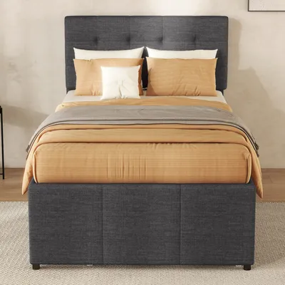 A bed with bedding in a room.