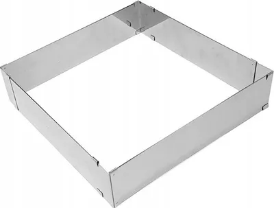 A square metal cake ring on a white background.