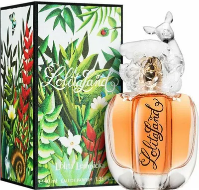 A perfume bottle and its box are displayed together against a white background. The box features a vibrant, tropical jungle illustration with various plants and a butterfly. The perfume bottle is a distinctive shape with an orange-tinted liquid and a clear