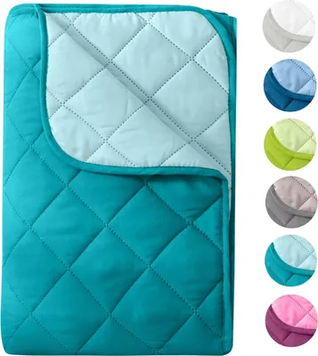 A folded quilted blanket shown from above, with a collage of color swatches on the right.