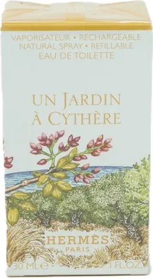 The image shows the front of a perfume box with an illustration of a garden scene.