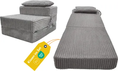 Two views of a folded grey mattress, one folded into a chair-like shape and the other laid out flat, with a yellow tag.