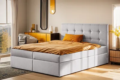 A bedroom scene with a bed, dresser, and window.