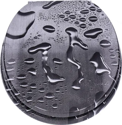 A close-up, top-down view of a toilet seat with water droplets on its surface.