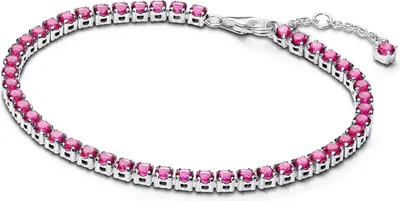 A close-up studio shot of a silver tennis bracelet with pink stones.
