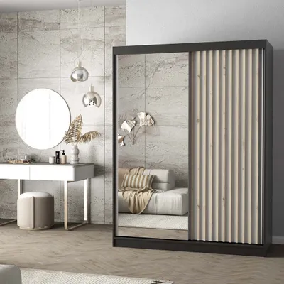 A bedroom scene featuring a sliding door wardrobe, a vanity table with a mirror, and decorative elements.