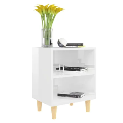 A white nightstand with two shelves, decorated with yellow flowers in a vase and two books.