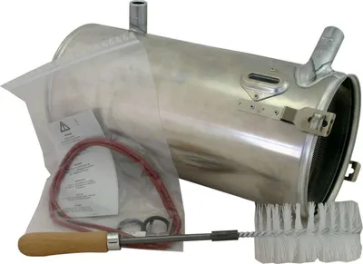 A product shot of a heating water heat exchanger and its accessories, laid out on a white background.